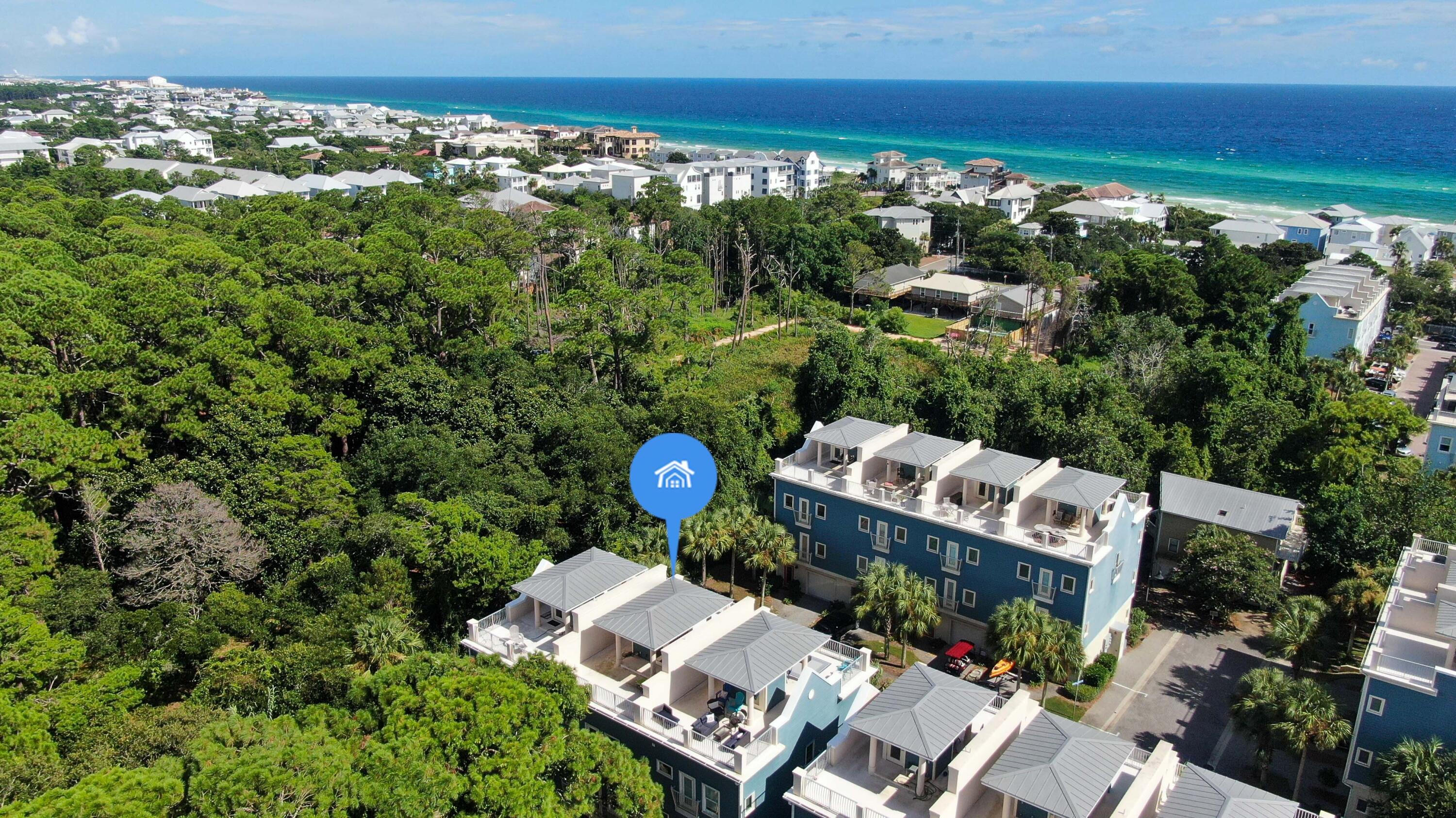 43 Coastal Grove Way, Unit 5 Santa Rosa Beach, FL 32459 - Photo 9 of 56 a view of a house with a swimming pool and outdoor seating