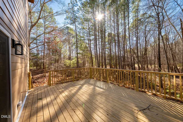 a view of a pathway with a wrought fence
