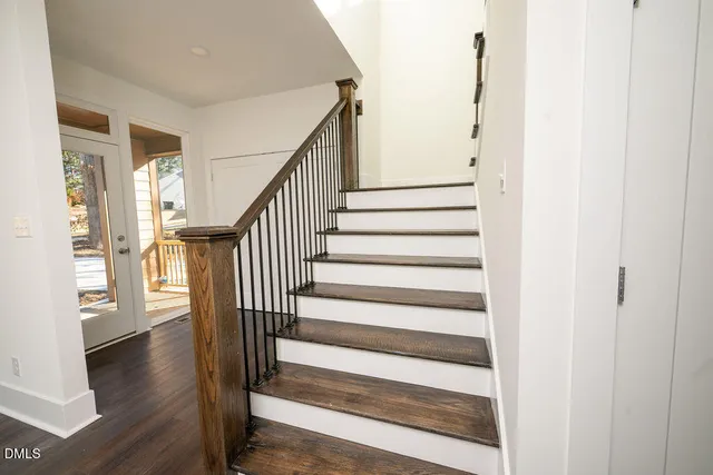 a view of entryway and hall with wooden floor