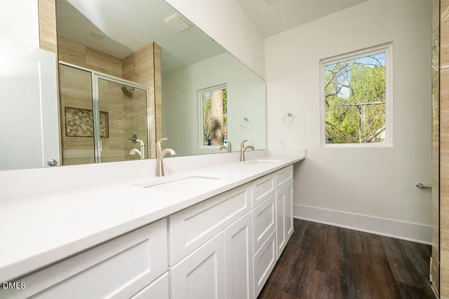 a bathroom with a sink and a large mirror