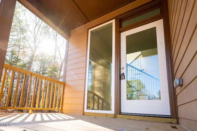 a view of a door with a door and wooden floor