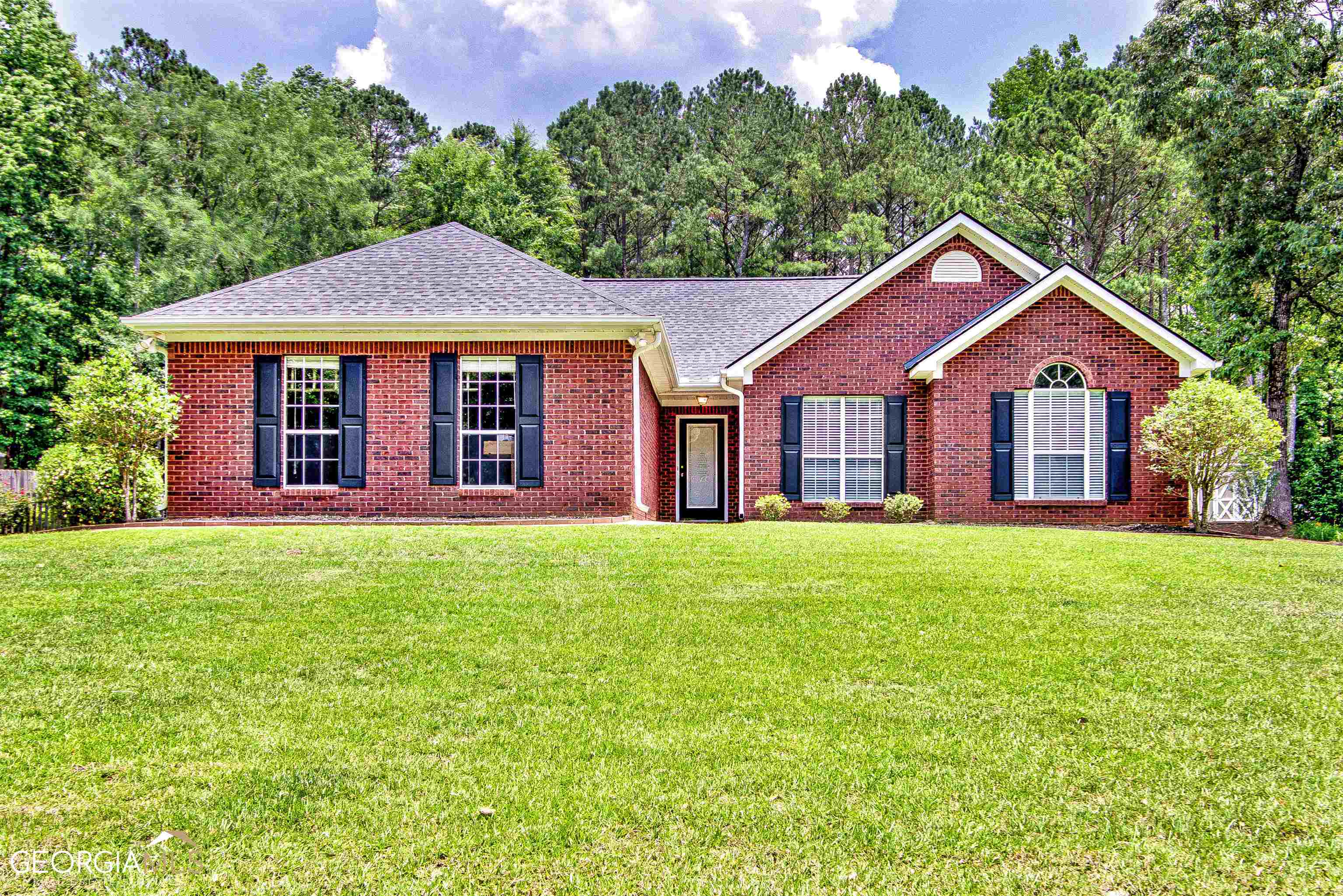 70 Riverside Court Sharpsburg, GA 30277 - Photo 1 of 1 a front view of a house with yard