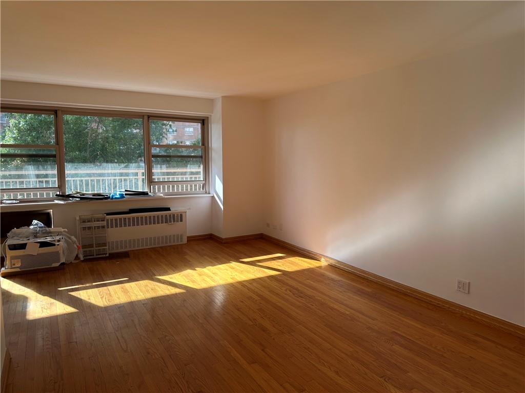 2935 West 5th Street, Unit 6D Brooklyn, NY 11224 - Photo 2 of 13 a living room with a window