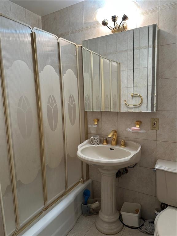 2935 West 5th Street, Unit 6D Brooklyn, NY 11224 - Photo 10 of 13 a bathroom with a sink toilet and shower