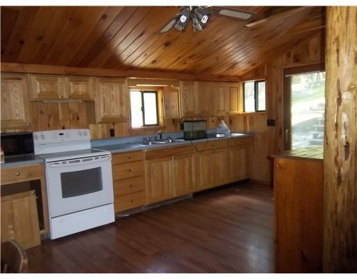 32 Bald Mountain Road Rangeley, ME 04964 - Photo 8 of 15 Kitchen. kitchen has wood floors...