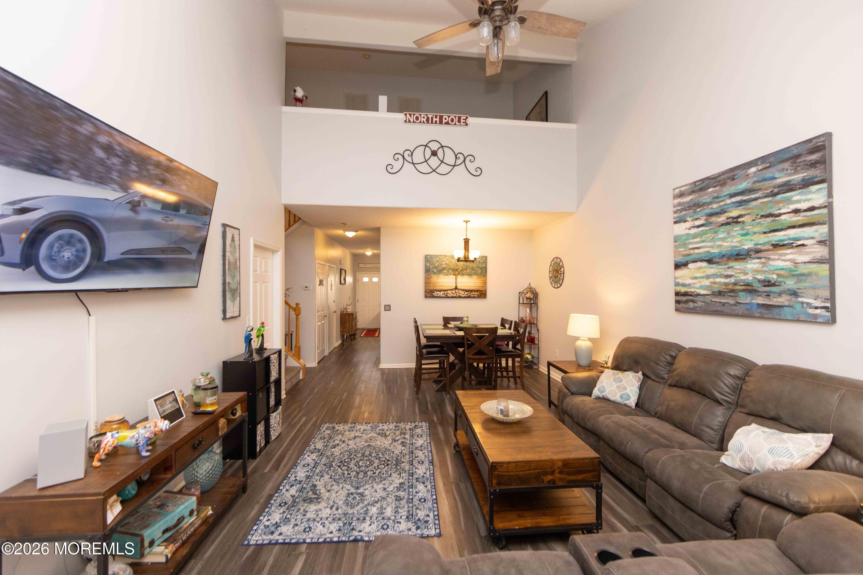52 Riva Boulevard, Unit 1967 Brick, NJ 08723 - Photo 4 of 15 a living room with furniture and a rug