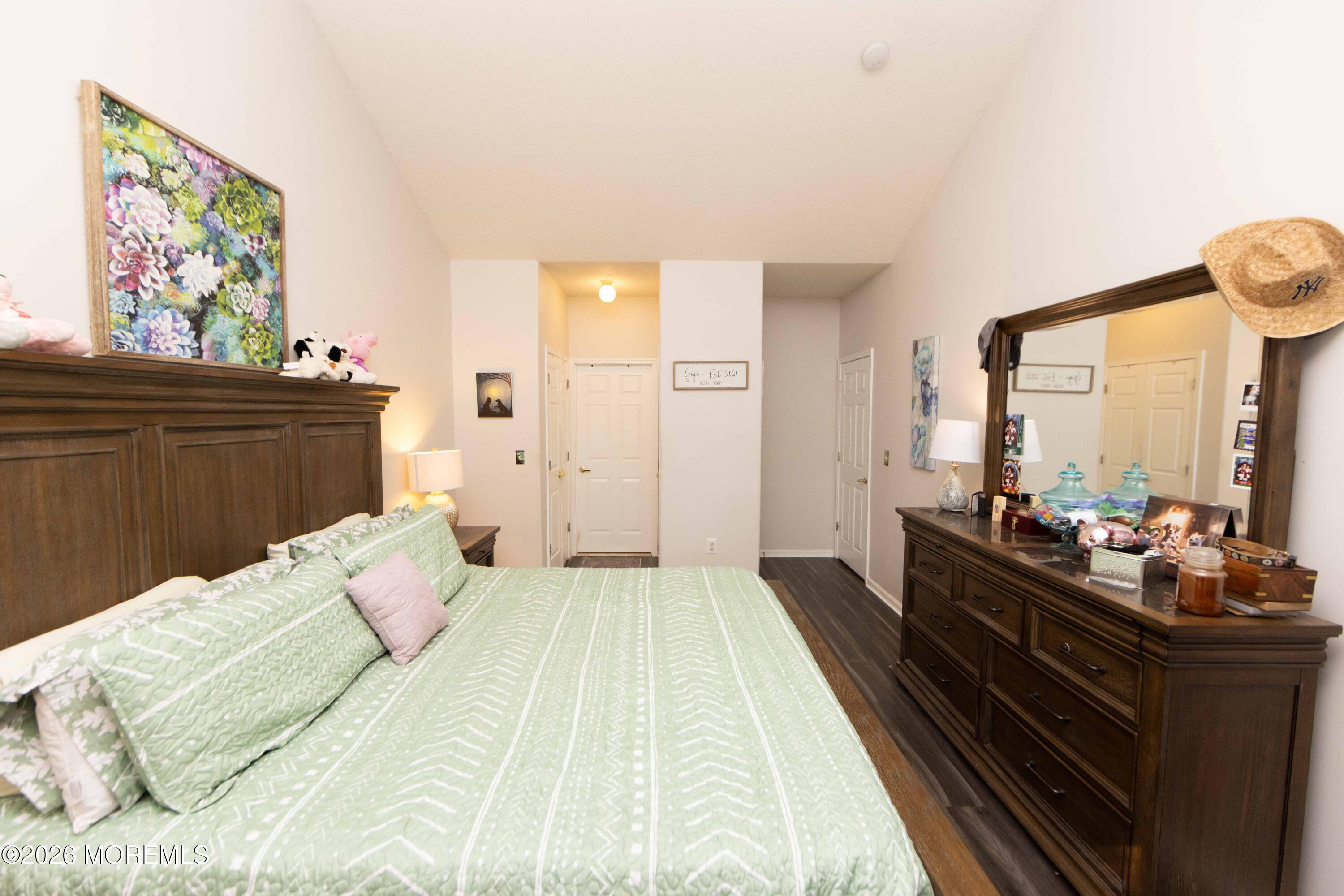 52 Riva Boulevard, Unit 1967 Brick, NJ 08723 - Photo 5 of 15 a bedroom with a bed and a large window