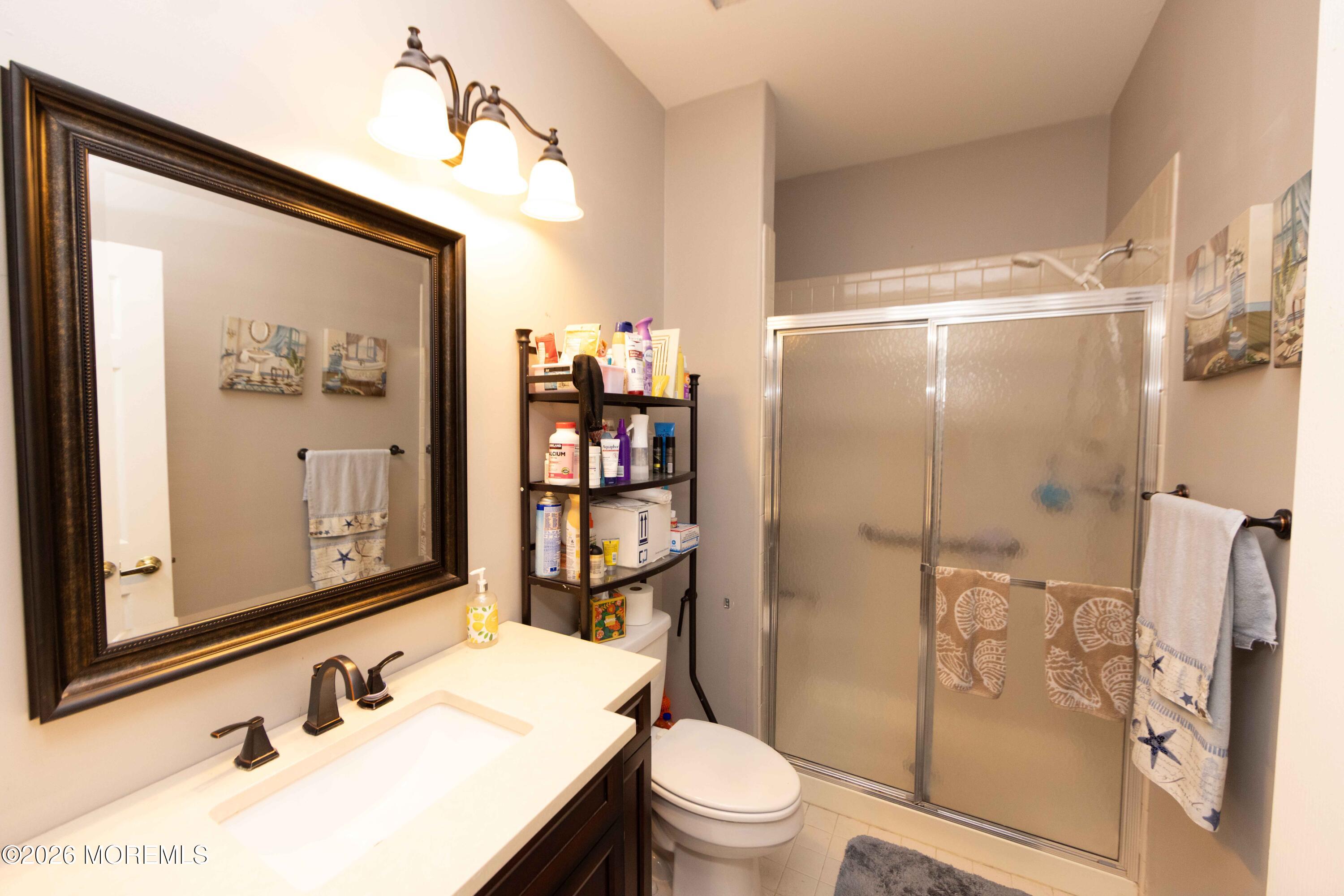 52 Riva Boulevard, Unit 1967 Brick, NJ 08723 - Photo 7 of 15 a bathroom with a sink toilet and shower