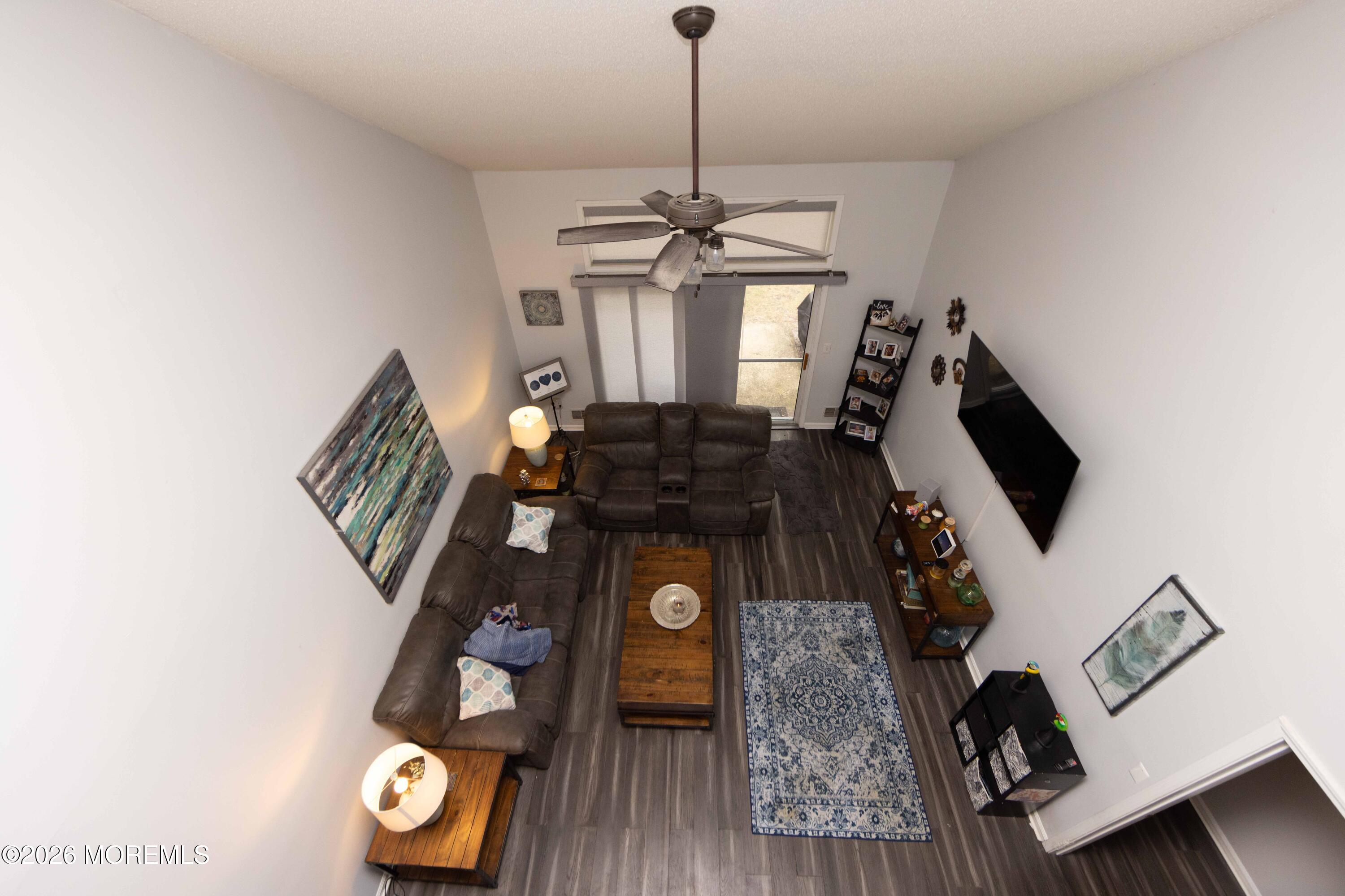 52 Riva Boulevard, Unit 1967 Brick, NJ 08723 - Photo 9 of 15 a living room with furniture and wooden floor