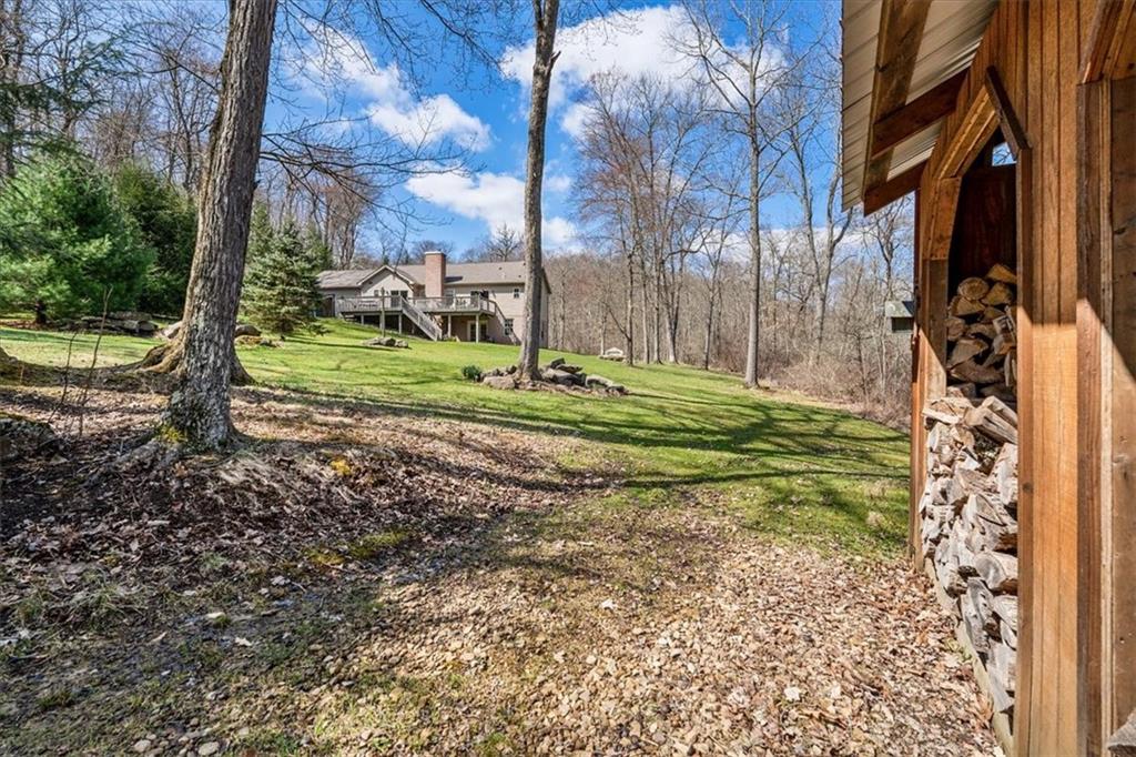 4199 Woodland Road Butler, PA 16002 - Photo 30 of 42 a backyard of a house with lots of green space