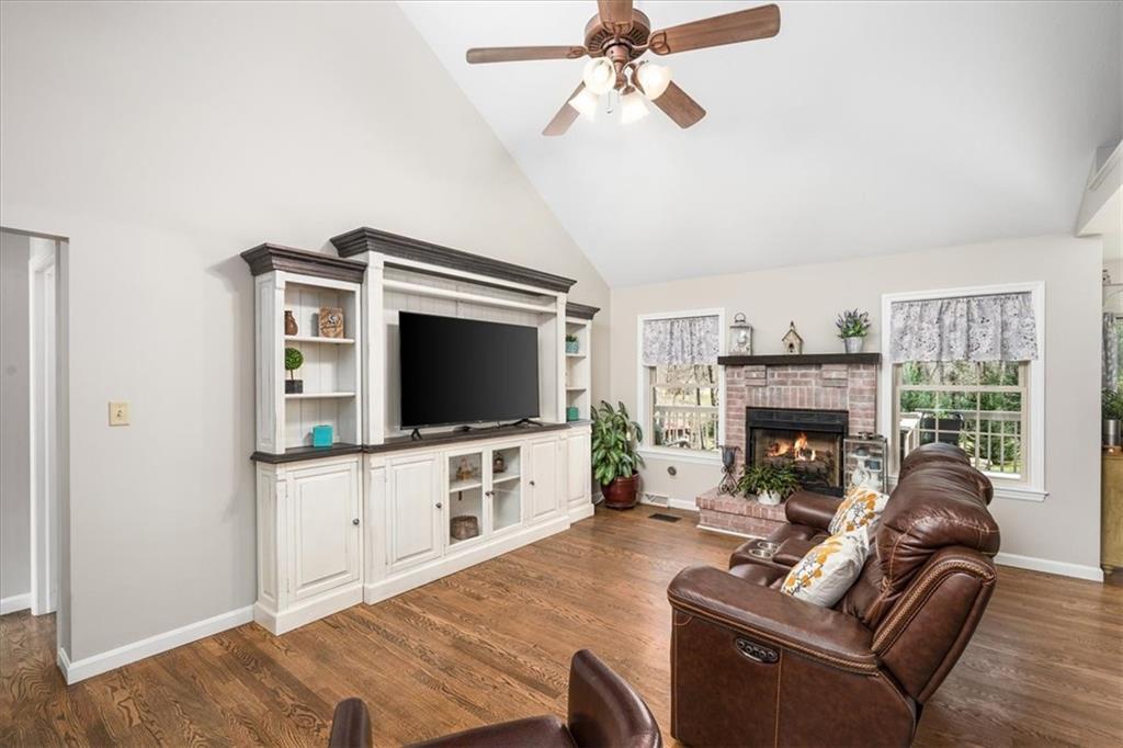 4199 Woodland Road Butler, PA 16002 - Photo 3 of 42 a living room with furniture a flat screen tv and a fireplace