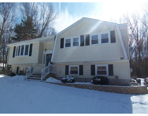 39 Heritage Road Billerica, MA 01821 - Photo 2 of 21 a house view with a garden space
