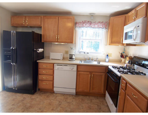 39 Heritage Road Billerica, MA 01821 - Photo 6 of 21 a kitchen with a sink stove and refrigerator