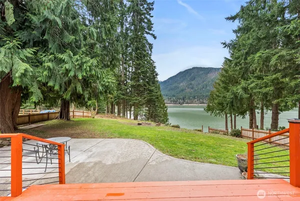 a view of a backyard with large trees