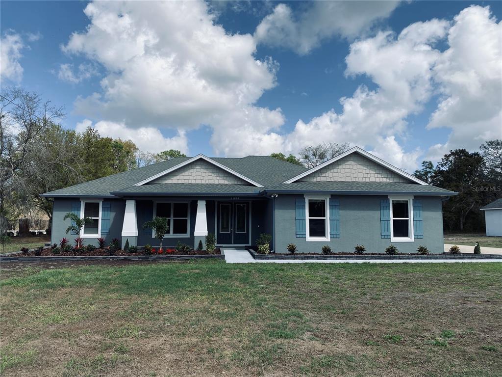 11802 Shadow Run Boulevard Riverview, FL 33569 - Photo 1 of 51 a front view of a house with garden