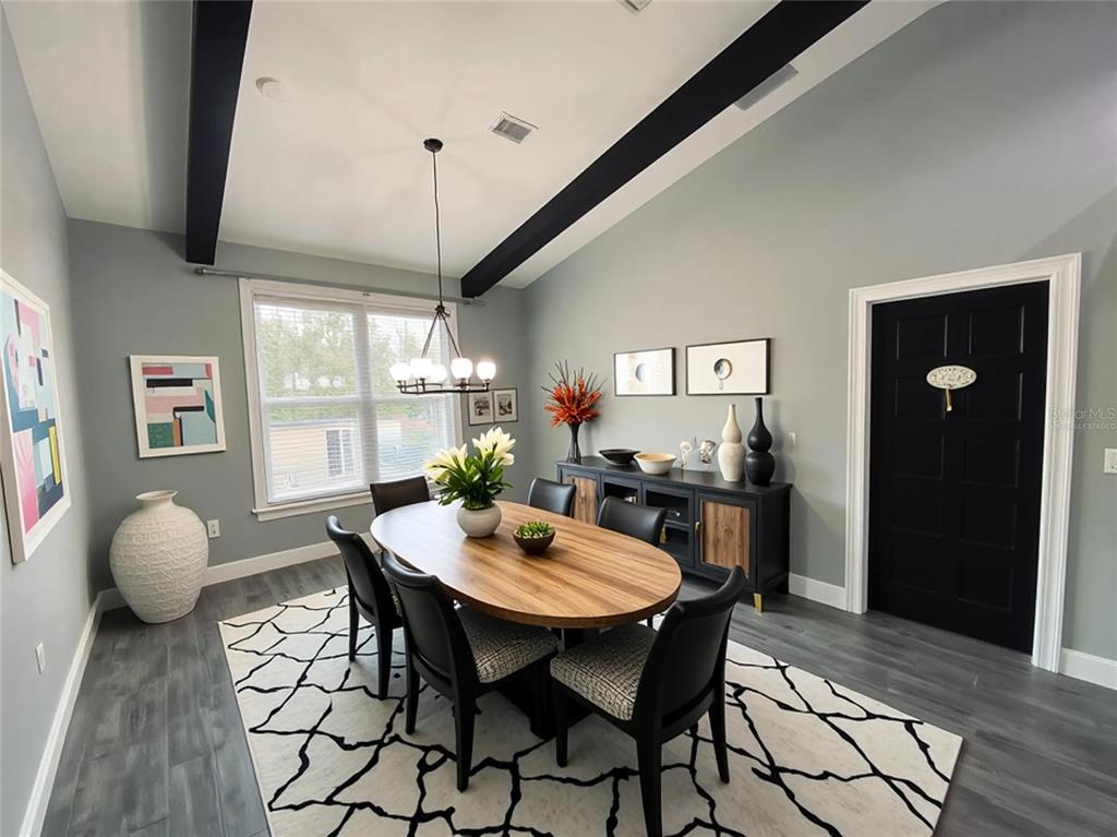 11802 Shadow Run Boulevard Riverview, FL 33569 - Photo 11 of 51 a view of a dining room with furniture window and wooden floor