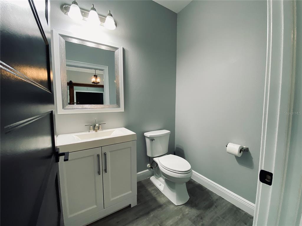 11802 Shadow Run Boulevard Riverview, FL 33569 - Photo 37 of 51 a bathroom with a toilet sink and mirror