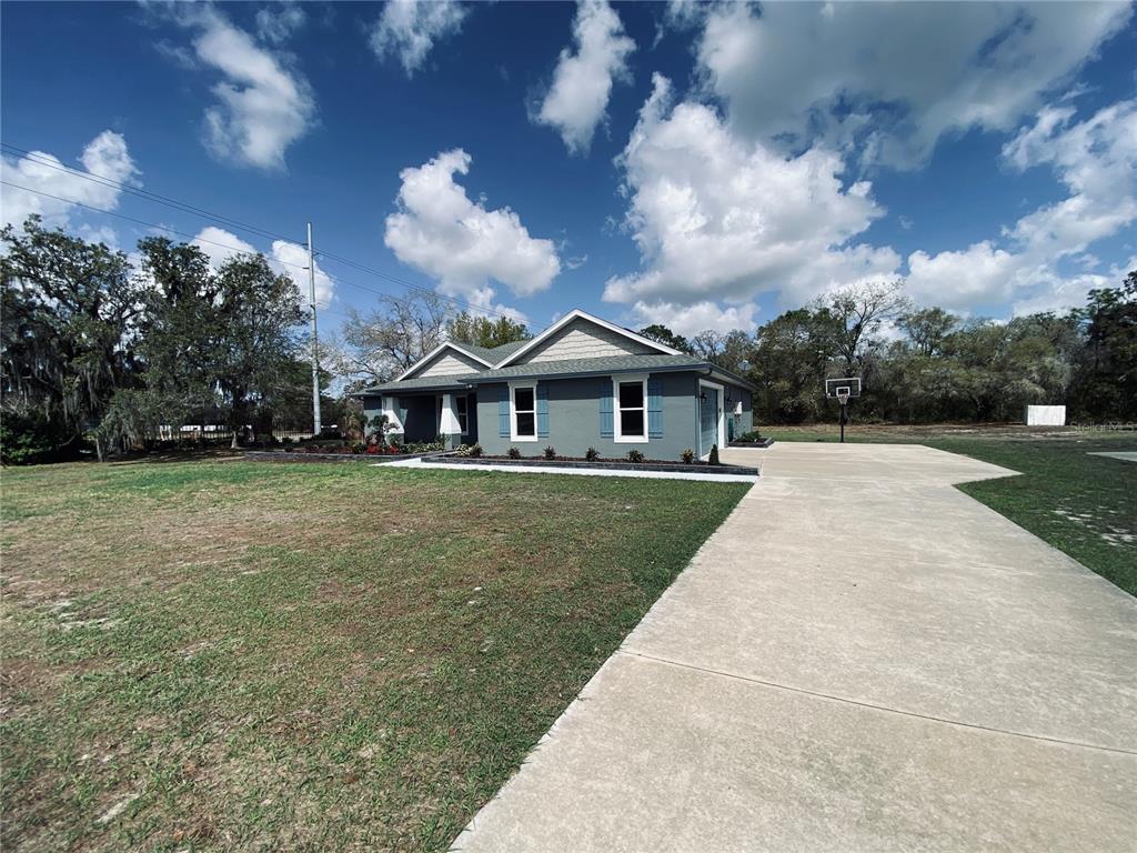 11802 Shadow Run Boulevard Riverview, FL 33569 - Photo 39 of 51 a front view of house with yard and green space