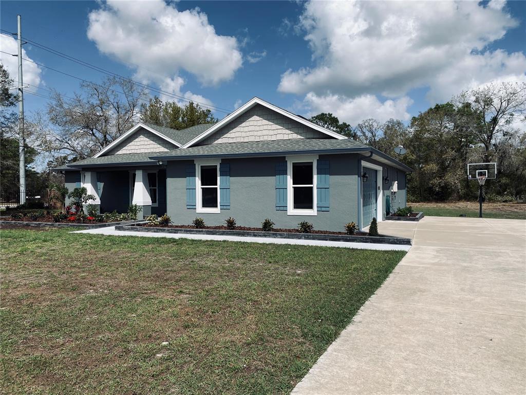 11802 Shadow Run Boulevard Riverview, FL 33569 - Photo 40 of 51 a front view of a house with garden