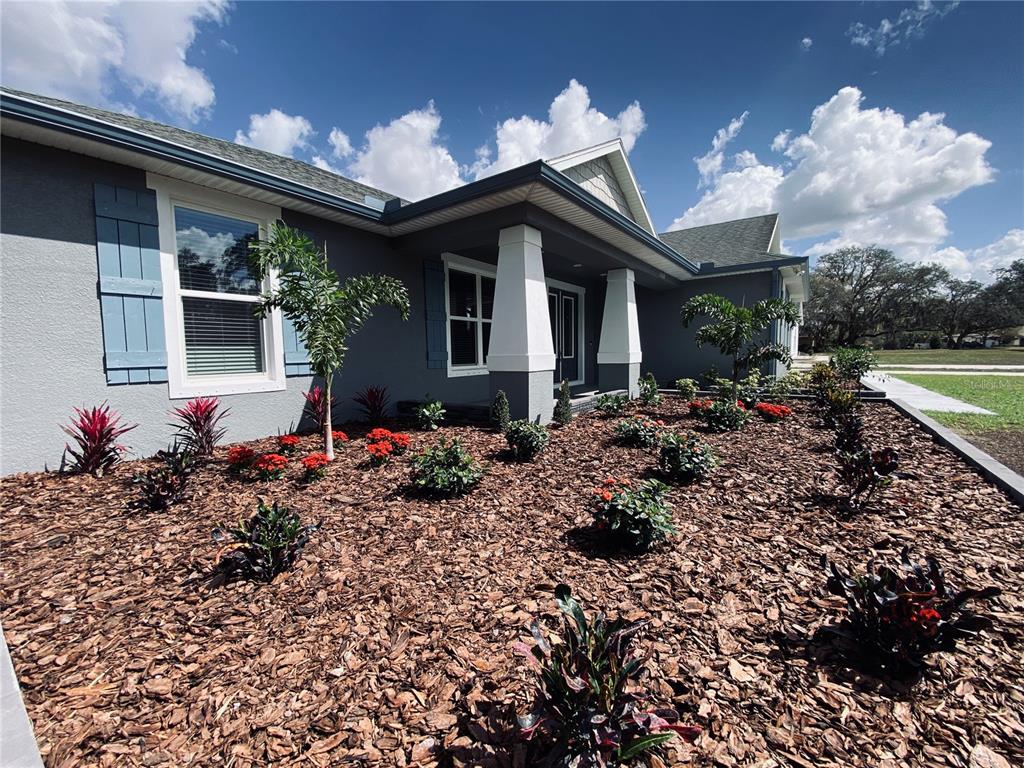 11802 Shadow Run Boulevard Riverview, FL 33569 - Photo 41 of 51 a front view of a house with garden