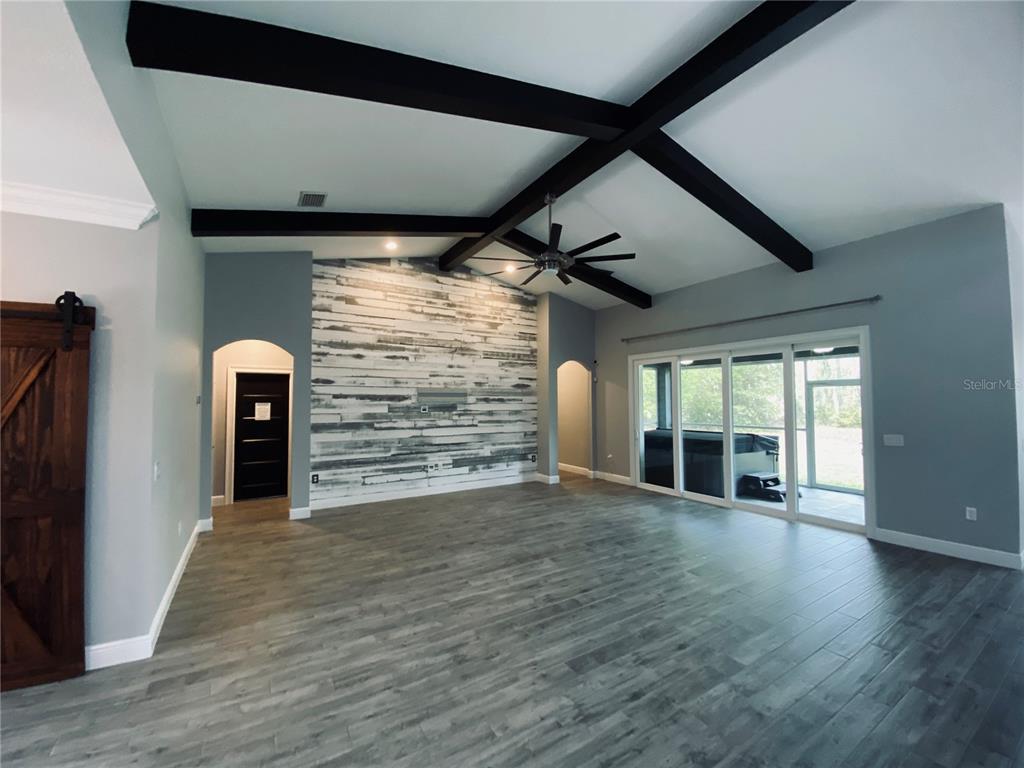 11802 Shadow Run Boulevard Riverview, FL 33569 - Photo 6 of 51 a view of a room with wooden floor and windows