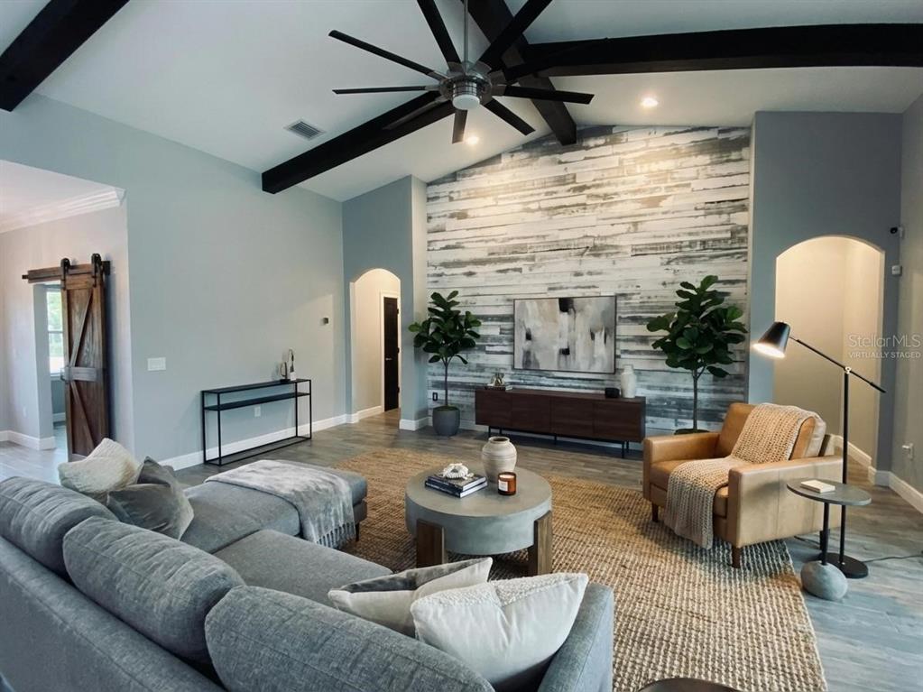 11802 Shadow Run Boulevard Riverview, FL 33569 - Photo 7 of 51 a living room with furniture and a large window