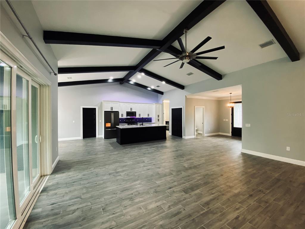 11802 Shadow Run Boulevard Riverview, FL 33569 - Photo 10 of 51 a view of a livingroom with a kitchen and a stove top oven