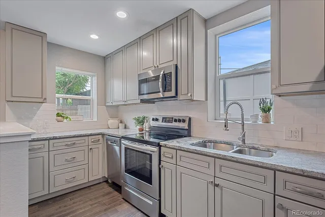 a kitchen with sink cabinets and window