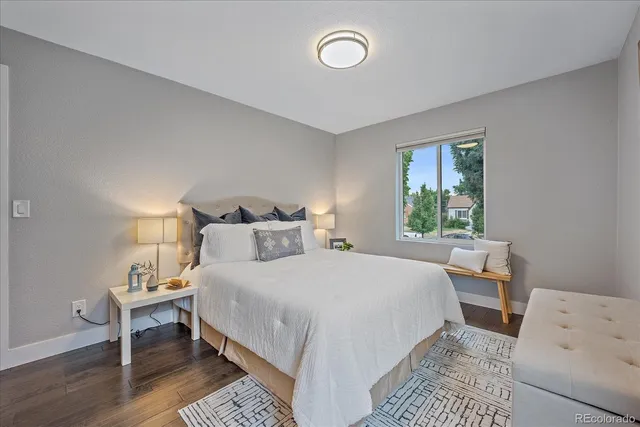 a bedroom with a bed and a table