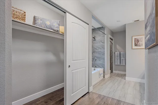 a bathroom with a glass shower door