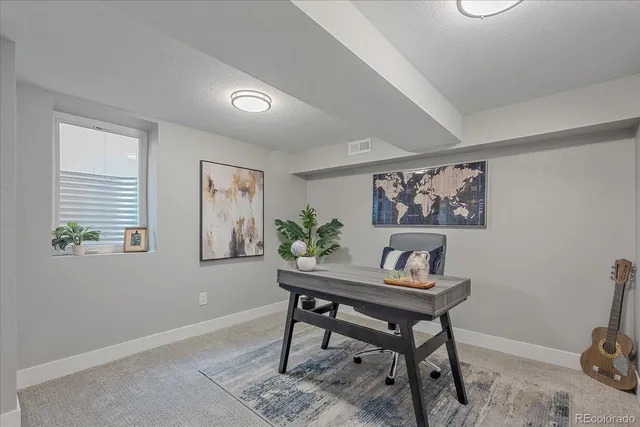 a workspace with furniture and a window