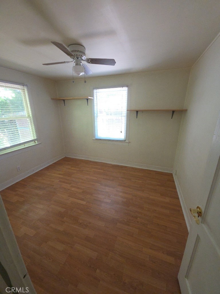 9633 Middle Creek Road Upper Lake, CA 95485 - Photo 16 of 18 an empty room with a window and ceiling fan