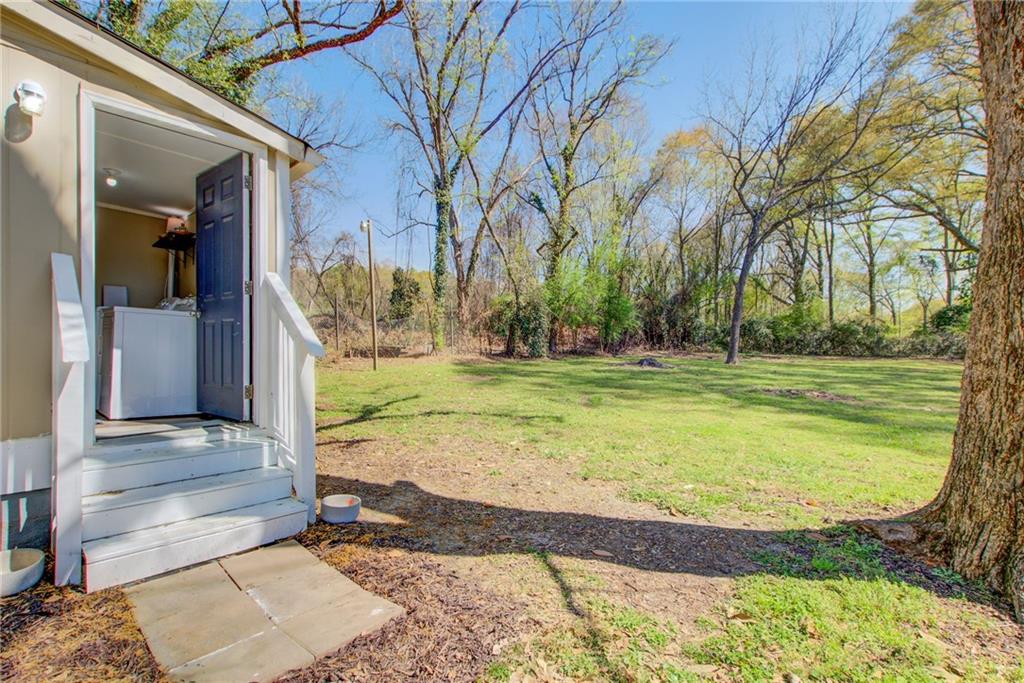 411 Ash Street Monroe, GA 30655 - Photo 14 of 36 a view of a house with a yard