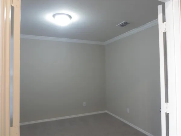 an empty room with a bathroom
