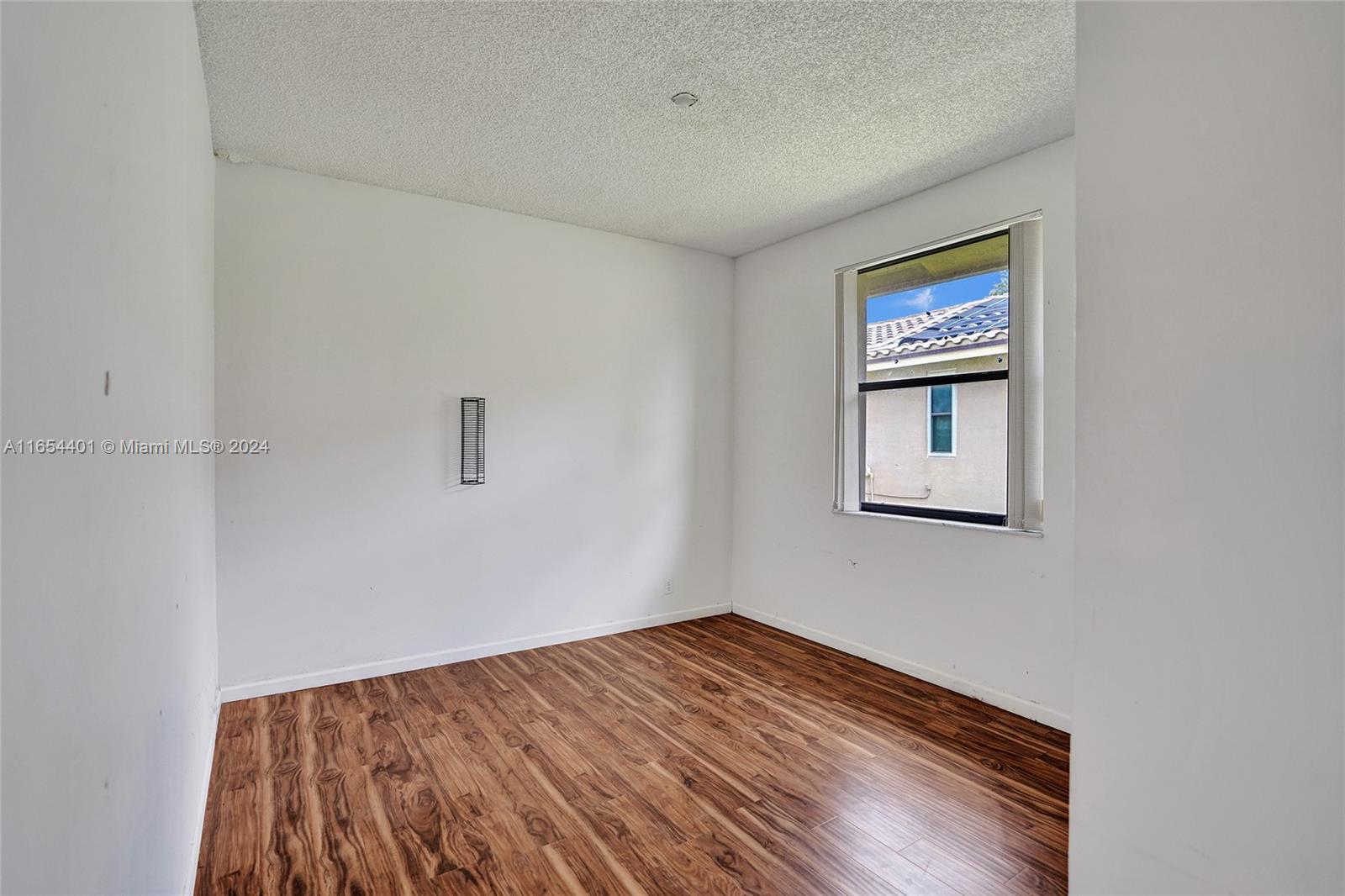22200 Cranbrook Road Boca Raton, FL 33428 - Photo 41 of 80 a view of a room with wooden floor and white walls