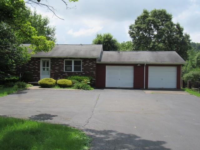 382 Walnut Hill Road Uniontown, PA 15401 - Photo 1 of 22 a front view of house with yard and trees