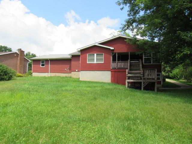 382 Walnut Hill Road Uniontown, PA 15401 - Photo 4 of 22 a front view of a house with a garden