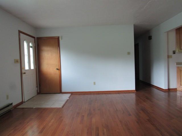 382 Walnut Hill Road Uniontown, PA 15401 - Photo 7 of 22 an empty room with wooden floor and windows