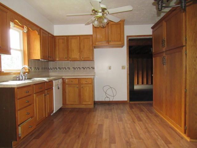 382 Walnut Hill Road Uniontown, PA 15401 - Photo 8 of 22 a kitchen with kitchen island granite countertop a sink appliances cabinets and wooden floor