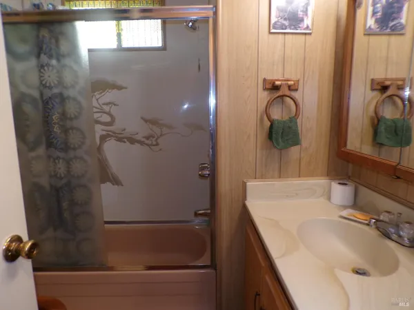 a bathroom with a sink and mirror