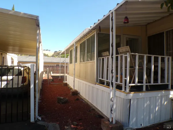 a view of a balcony with chairs