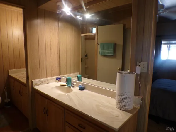 a bathroom with a sink and a mirror