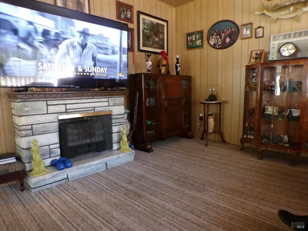 a view of a fireplace with wooden floor