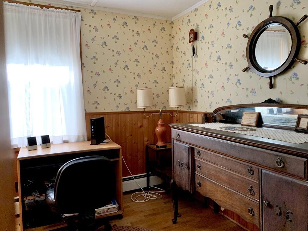 191 Phillips Road Bourne, MA 02562 - Photo 17 of 41 a view of a workspace with furniture and a mirror