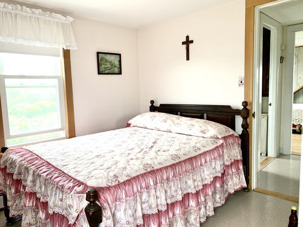 191 Phillips Road Bourne, MA 02562 - Photo 23 of 41 a bedroom with a bed and a window