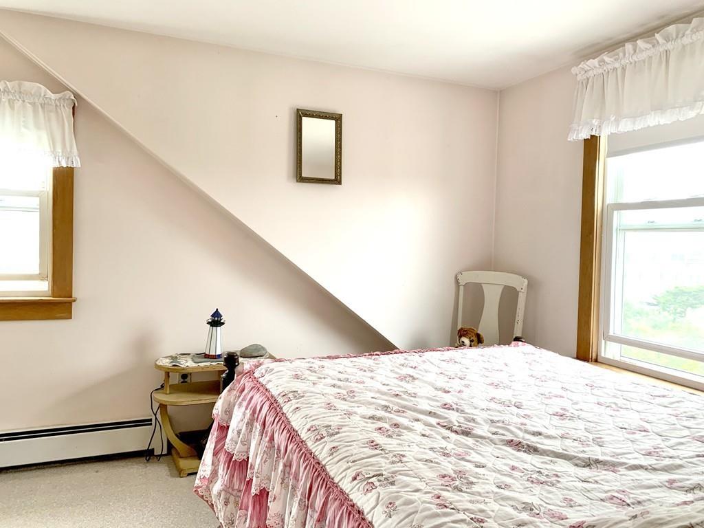 191 Phillips Road Bourne, MA 02562 - Photo 24 of 41 a bedroom with a bed and a window