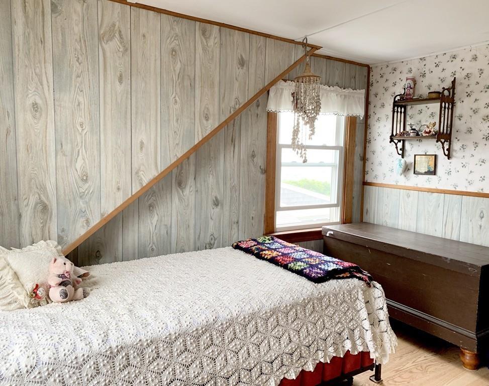191 Phillips Road Bourne, MA 02562 - Photo 27 of 41 a bedroom with a bed and a window