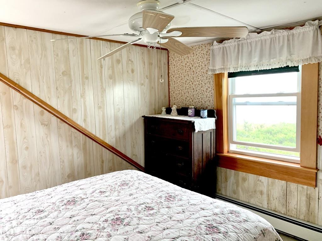 191 Phillips Road Bourne, MA 02562 - Photo 29 of 41 a bedroom with a bed and a window