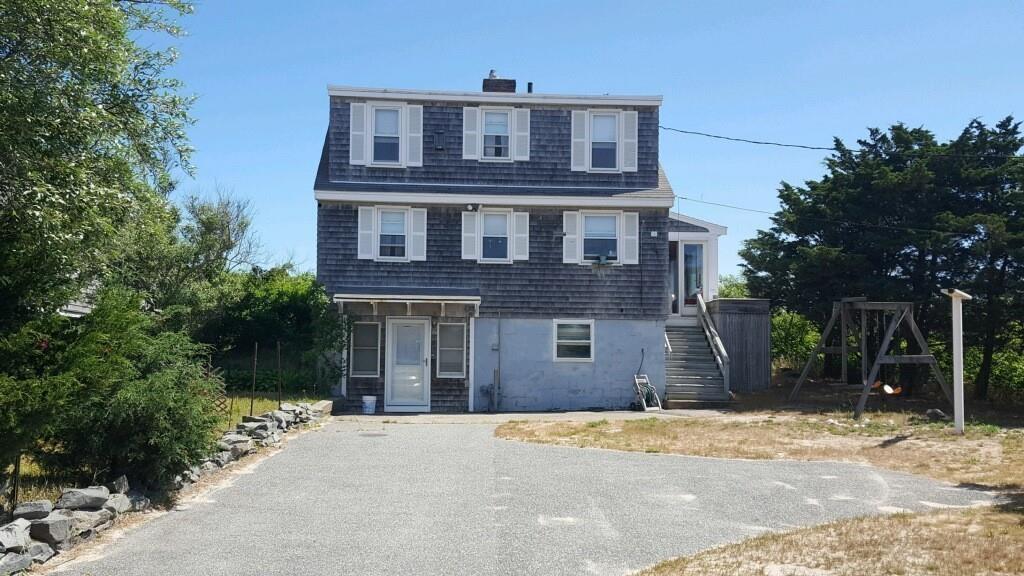 191 Phillips Road Bourne, MA 02562 - Photo 4 of 41 a front view of a house with a yard
