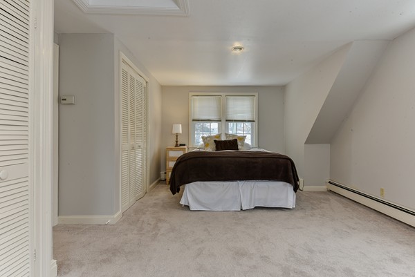 15 Charles Street Natick, MA 01760 - Photo 12 of 21 a bedroom with a bed and window